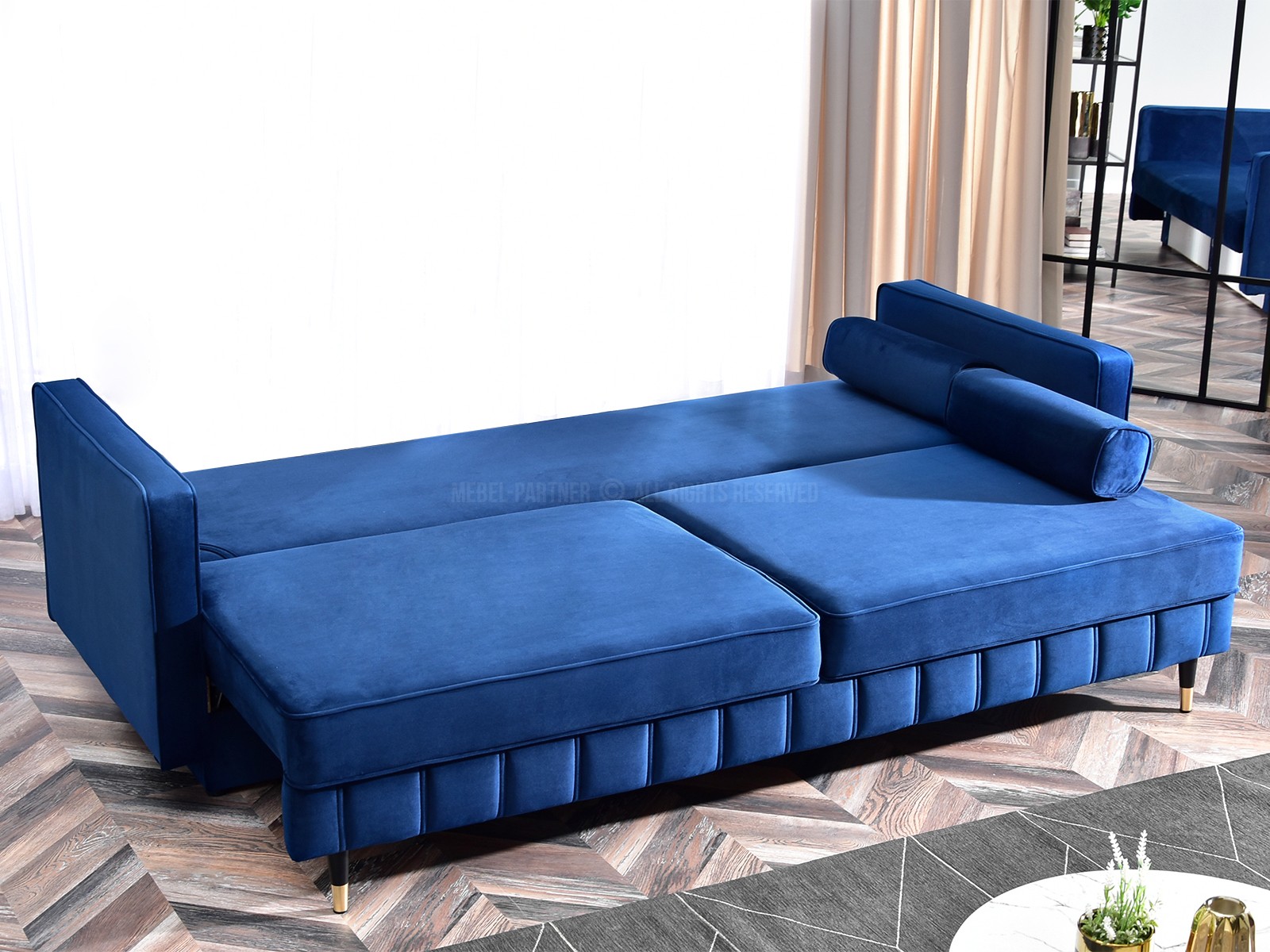 Sofa welurowa z funkcją spania CALVO GRANAT poduszki wałek - charakterystyczne detale