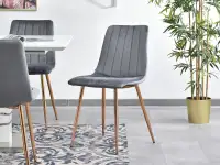 Krzesło z weluru MEGAN SZARE przeszywane na miedzianej nodze - designerska bryła