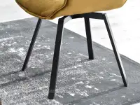 Wygodne krzesło do jadalni ZŁOTE ARUBA NA CZARNEJ NODZE - ponadczasowe krzesło z czarną podstawą