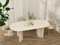 Owalny stół o zaokrąglonej formie do salonu w KREMOWEJ BIELI LIVARO - blat o szerokości 220 cm