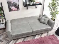 Designerska kanapa BLINK MORSKA pikowana z poduchami - powierzchnia spania