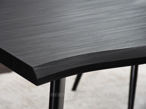 Funkcjonalny stół o nieregularnym kształcie na czterech nogach