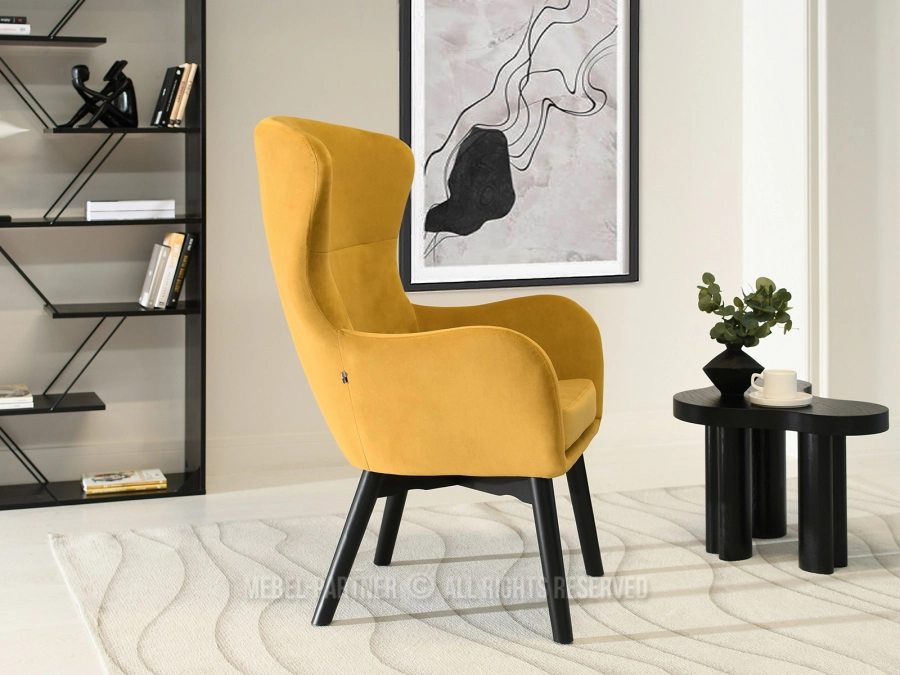 Welurowy fotel do salonu w modnym kolorze